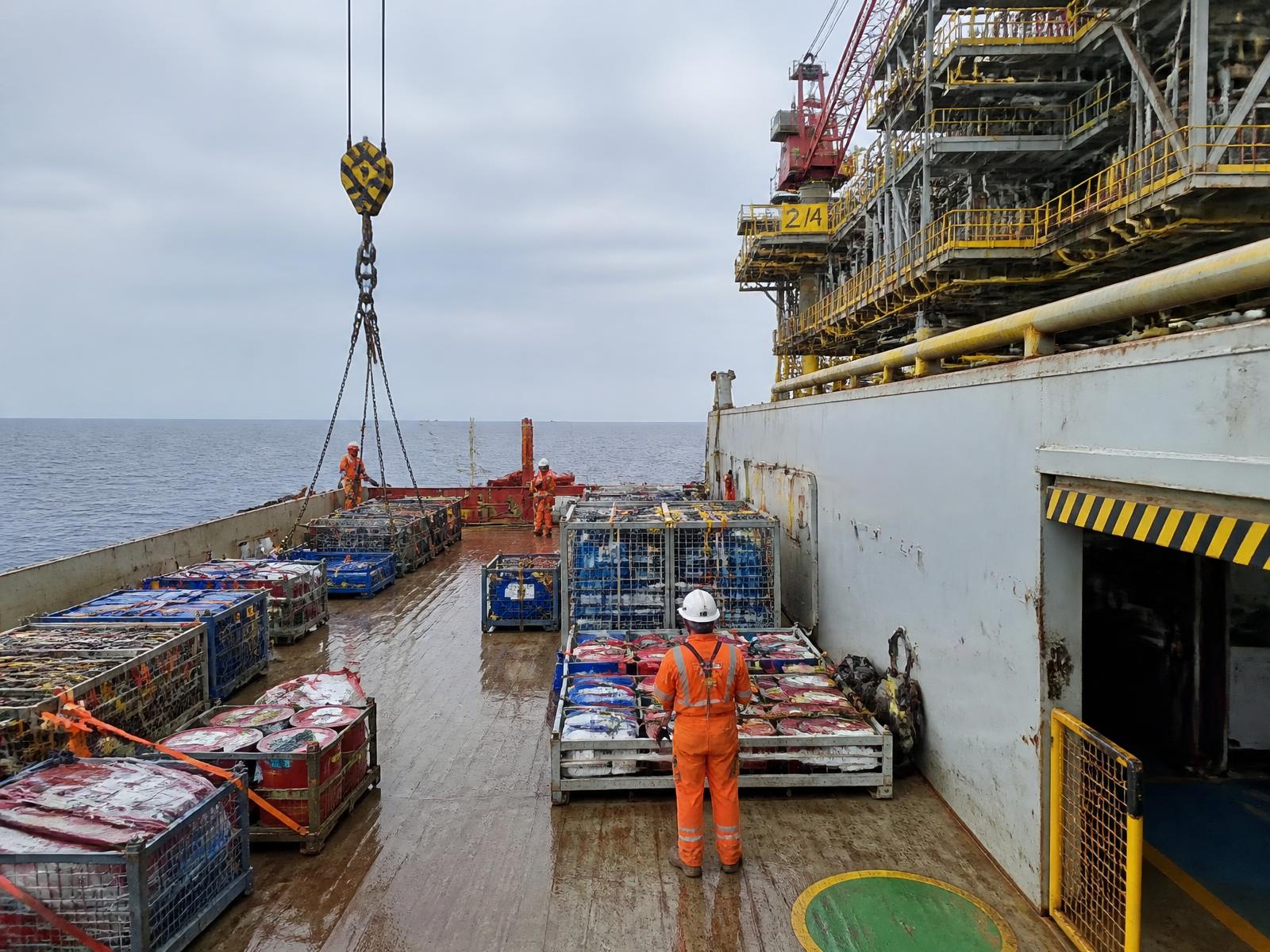 Offshore supply vessel deck loaded with cargo baskets