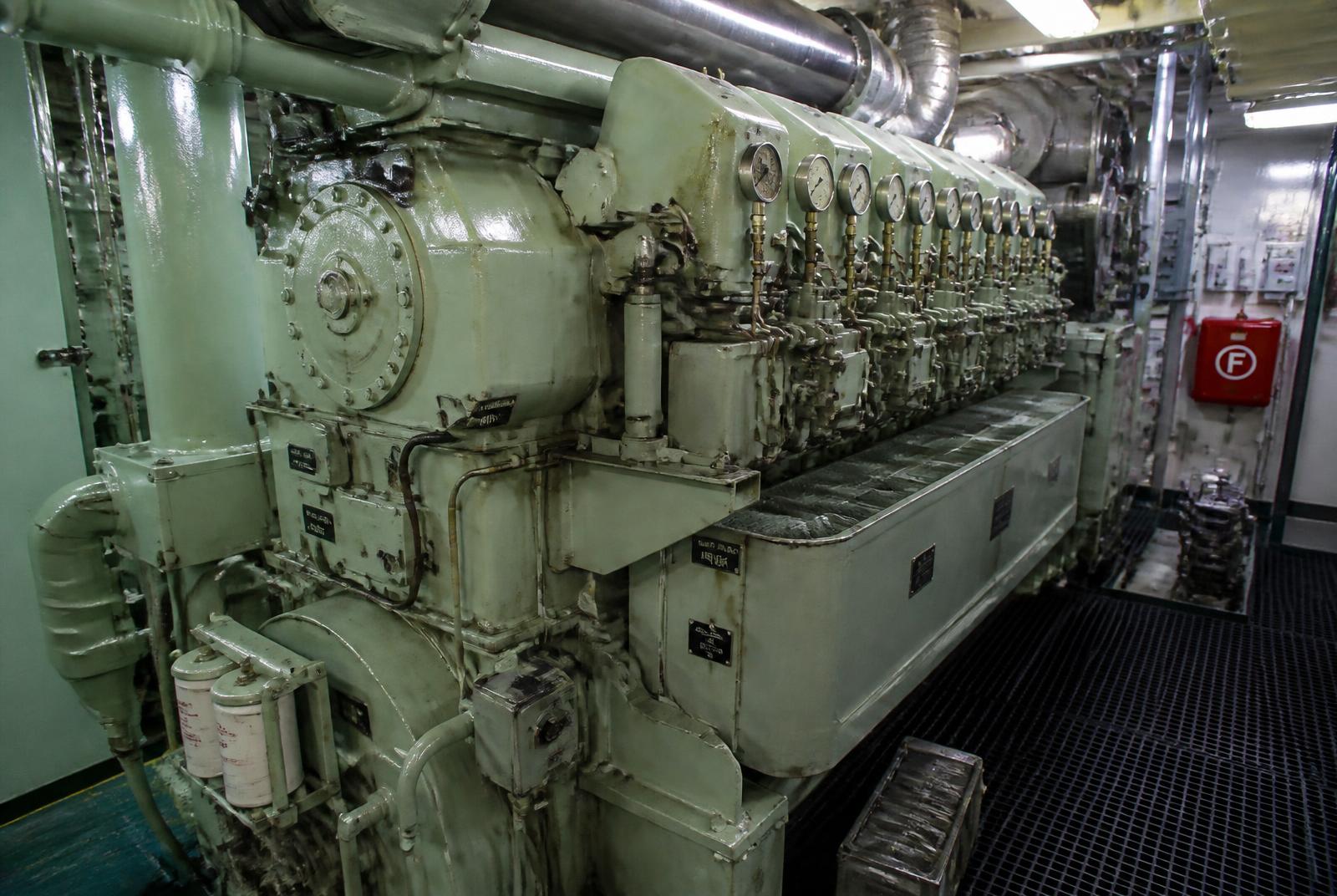 Marine diesel engine and pipework in a ship engine room